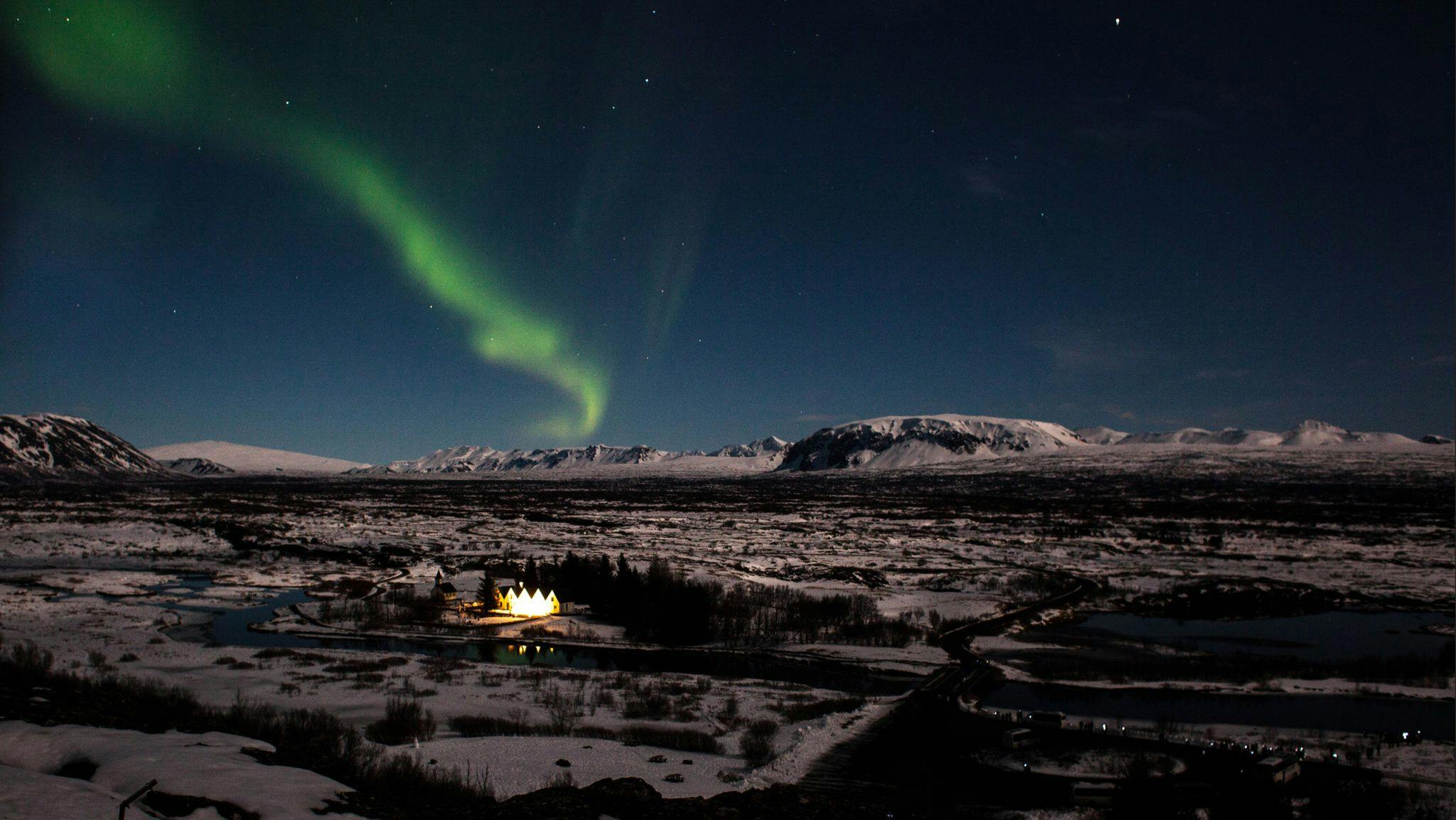Aurora borealis over Þingvellir National Park during winter in Iceland